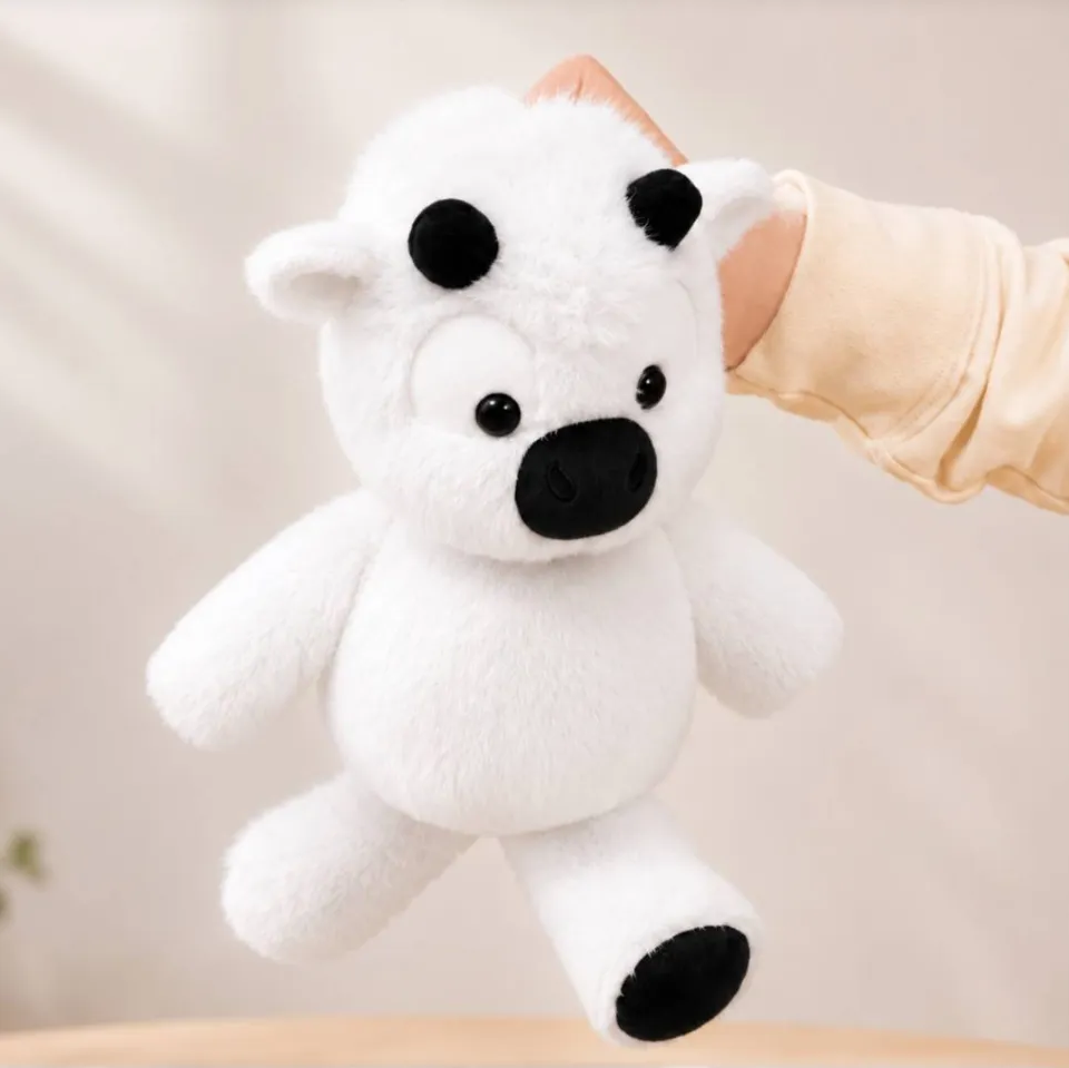 Peluche vache qui court